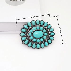 Detail view of Bohemian belt buckle showing turquoise inlay and 9cm x 7.2cm dimensions