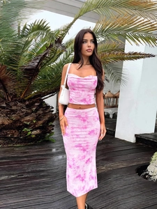 Pink tie-dye two-piece set featuring a cowl neck crop top and bodycon midi skirt for summer
