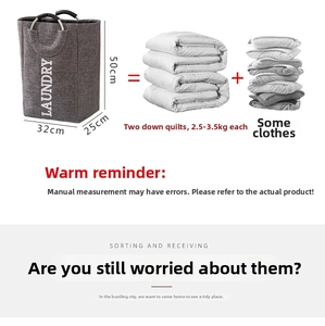 Detail of grey laundry basket with metal handles showing 50x32x25cm dimensions and capacity