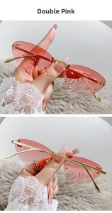 Detail view of rimless cat eye sunglasses with gradient pink lenses and rhinestone F accents