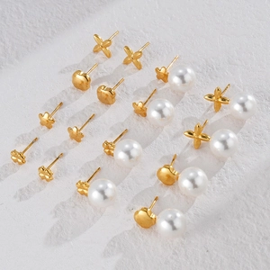 Elegant gold titanium steel earring set with pearl and floral star designs
