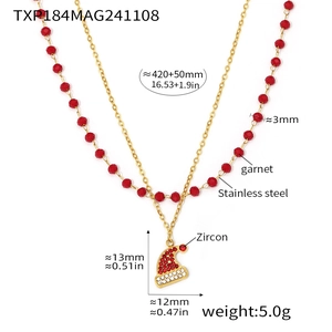 Detail showing two-layer Christmas hat necklace with red garnet beads and gold steel chain