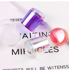 Detailed view of colorful iridescent nail art stampers with silicone heads for French manicure