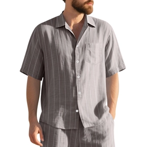 Detail of men's summer striped short sleeve shirt set with chest pocket and button-up front