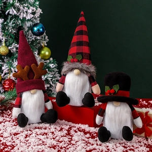 Three festive Christmas gnomes in red and black with plush beards for holiday decor