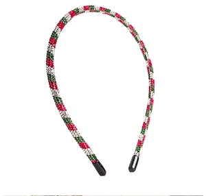 Macro detail of red, green, and white rhinestones on festive Christmas headband