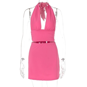 Detailed view of pink halter V-neck crop top and high waist bodycon mini skirt set