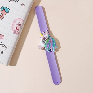 Detail of purple silicone slap watch with a 3D unicorn dial and clear numbered scales