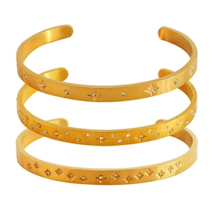 Set of three 18K gold plated stainless steel open bangles with zircon star details