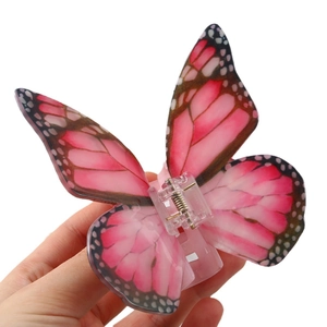 Elegant butterfly hair claw clip with pink gradient acrylic wings and spotted edges
