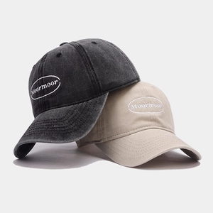 Vintage washed cotton baseball caps in charcoal and beige with Moormoor embroidery