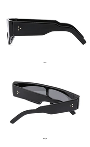 Detail view of retro wide-leg sunglasses in black showing the side and back profiles