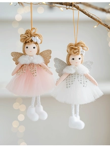 Detail of plush angel ornaments in pink and white mesh skirts with warm LED lighting