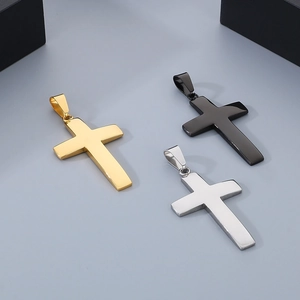 Detailed view of cross pendants in gold, black, and silver finishes made of stainless steel