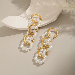 Elegant 18K gold plated stainless steel pearl drop earrings on aesthetic background