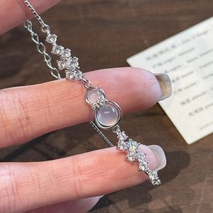 Exquisite zircon gourd bow bracelet in silver with translucent milky white stones