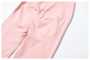 Detail of high waist ribbed waistband and seamless pink fabric for tummy control