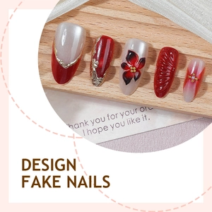 Faux ongles cat eye avec perles et dégradé rouge doré, forme amande élégante