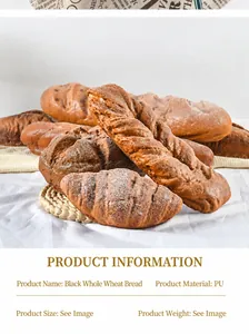 Makroaufnahme von realistischen schwarzen Roggenbrot-Modellen auf weißem Tuch