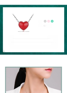 Detail of red heart pendant necklace on model showing 925 sterling silver chain