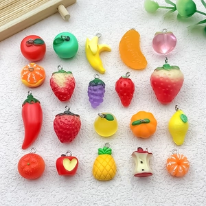 Detailed grid layout of colorful resin fruit pendants including strawberry and pineapple charms