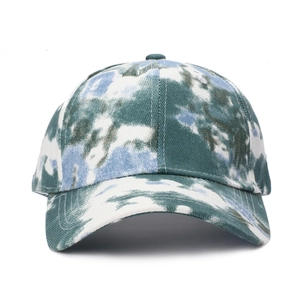 Detail of cotton baseball cap featuring blue and green tie-dye graffiti patterns