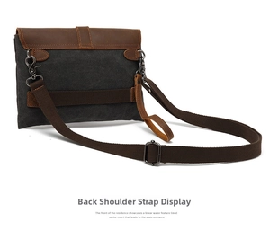 Detail view of the vintage canvas messenger bag back with leather strap and hardware