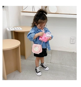 Close-up of pink rabbit crossbody bag for girls with cute bow detail and leather finish