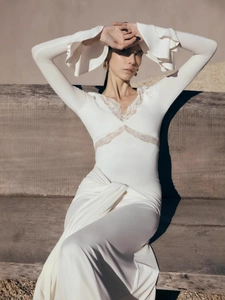White slim-fit V-neck dress with elegant lace panels and flared sleeves in nature
