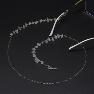 Golden eyewear chain with natural white quartz stones and non-slip rubber loops