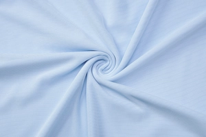 Detailed close-up of light blue mesh fabric with breathable texture and spiral pattern