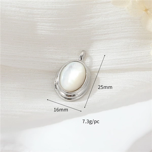 Detailed size view of silver oval shell pendant with zircon inlay 25mm height