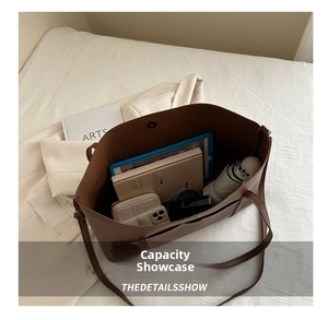Detail view of deep brown large leather tote bag interior showing spacious capacity for daily essentials