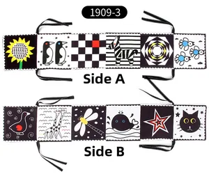 Close-up of double-sided high-contrast baby cloth book with animals and geometric patterns