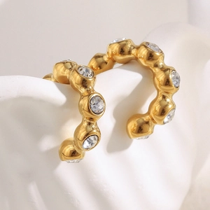 Close-up of 18K gold plated hoop earrings with sparkling round cubic zirconia stones