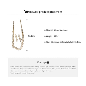 Detail view of gold-tone geometric jewelry set showing precise necklace and earring dimensions