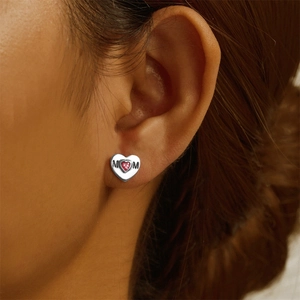 Close-up of S925 sterling silver heart stud earring with pink zircon and MOM engraving