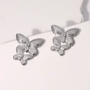 Vintage polished stainless steel double butterfly stud earrings with detailed texture