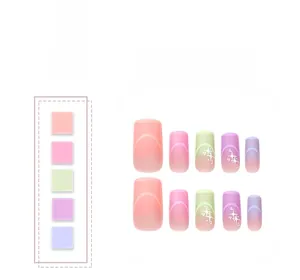 Detail of gradient pink and purple square press-on nails with star patterns and color swatches
