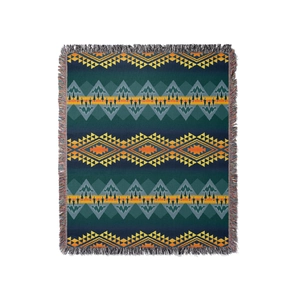Southwestern style bohemian picnic blanket with tribal geometric patterns and tassels