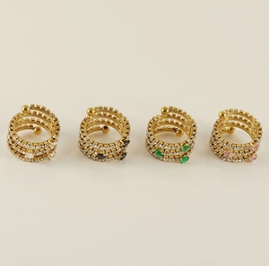 Macro detail of multi-layer spiral rings with cubic zirconia and heart stones