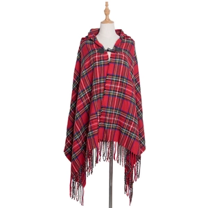 Detailed view of red plaid hooded cloak with classic horn buttons and fringe trim
