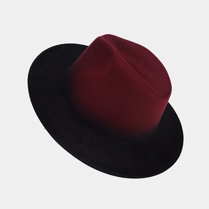 Detail view of burgundy and black gradient wool fedora hat with firm brim structure