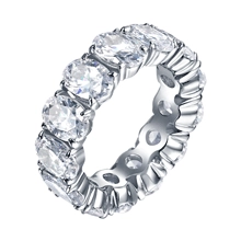 Macro view of silver eternity ring with oval-cut cubic zirconia in a full prong setting