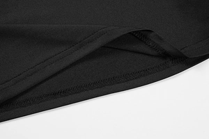 Macro shot of precise double-stitch hem and fine seam detail on black slim T-shirt