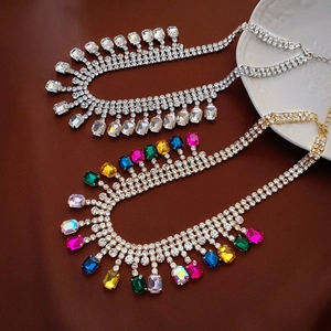 Chic geometric bib necklace with colorful crystals and fringe in a luxury fringe design