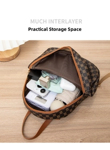 Detailed interior of vintage floral backpack showing organized multi-layer storage space