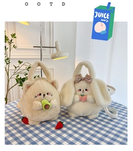 Detail of plush cat and rabbit handbags featuring avocado and peach embroidery