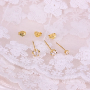 Detailed close-up of 925 sterling silver hallmarked gold star stud earrings set