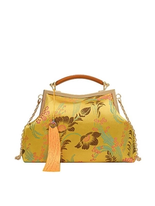 Elegant yellow Chinese embroidery handbag with floral patterns and golden chain strap